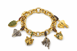 Gold panther charm with emerald green gemstone eyes and black enamel handcrafted in Italy
