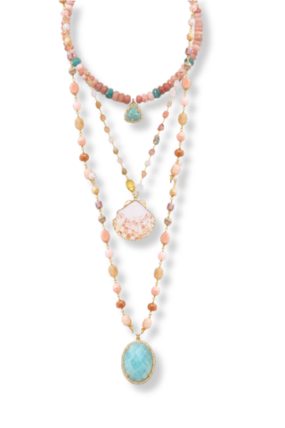Multistrand necklace with colorful beads and large central pendant on a white background