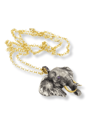 Silver elephant pendant necklace on gold chain by Amanda Marcucci